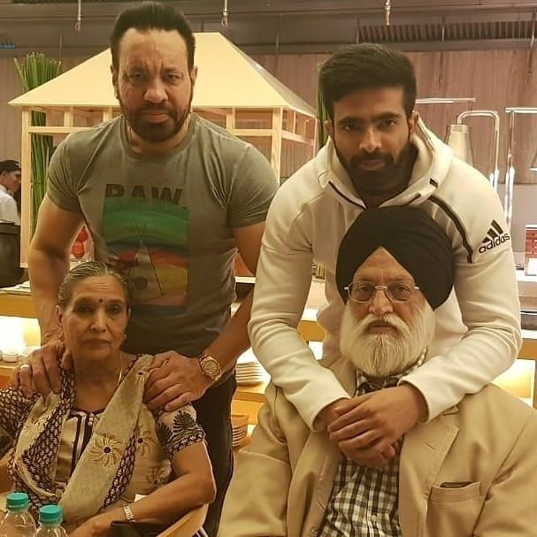 Shera with his parents