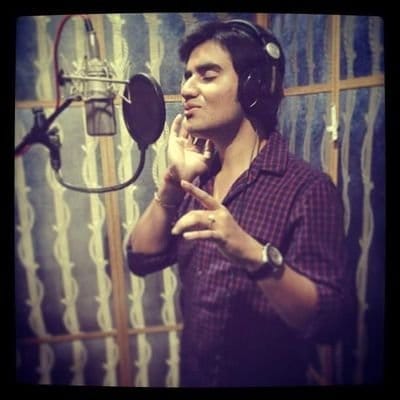 indresh singing in a recording mike