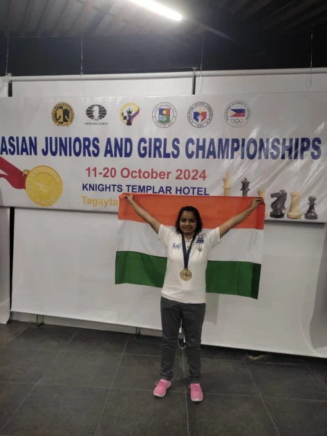 Bristy wearing her Asian Junior Girls Blitz Chess Championship gold medal